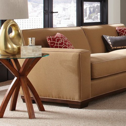 brown couch and coffee table with glass countertop on a beige carpet from Stoller Floors in Orrville, OH